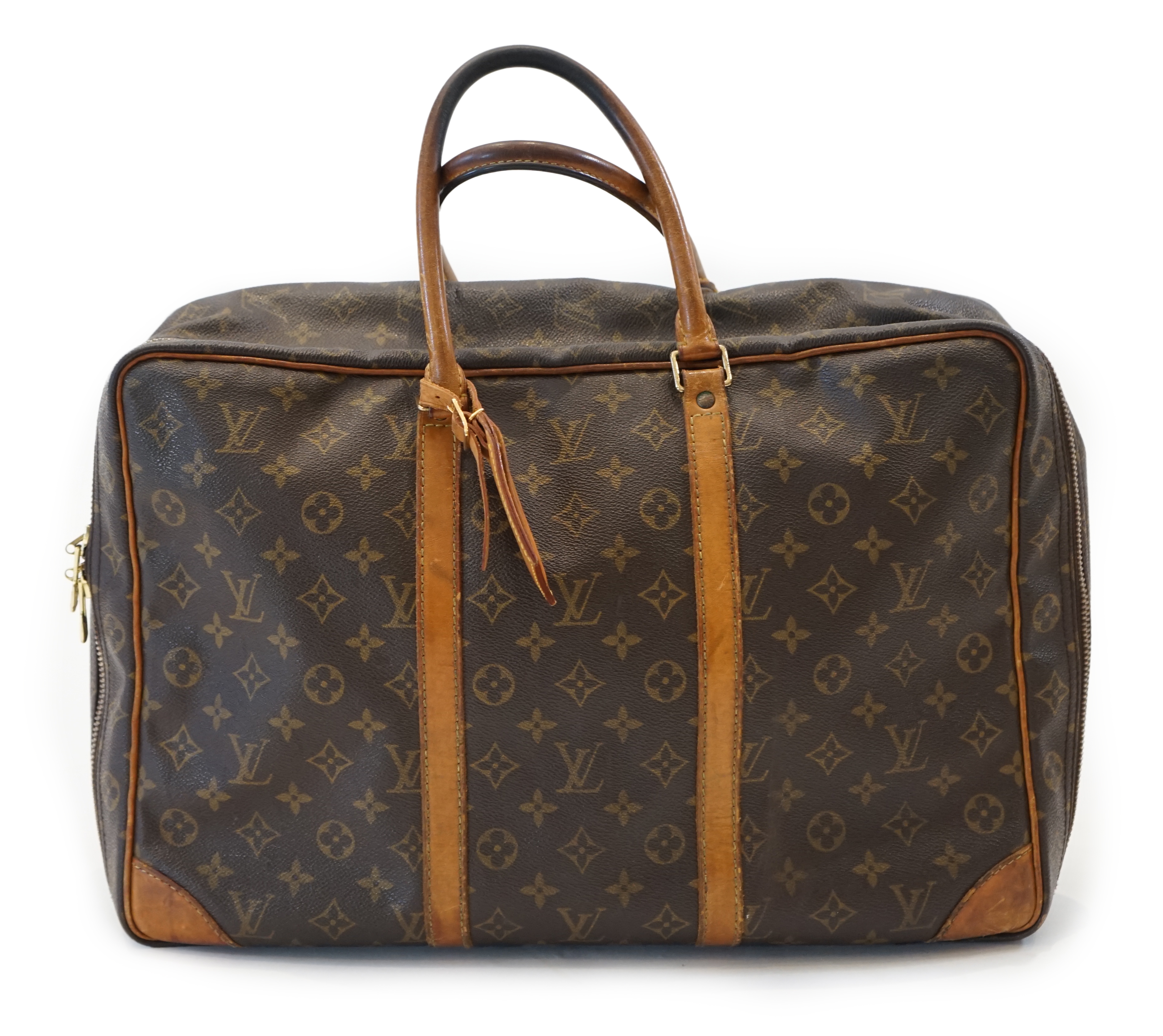 A Louis Vuitton Keepall leather travel bag with luggage tag width 13cm, length 45cm, height 30cm